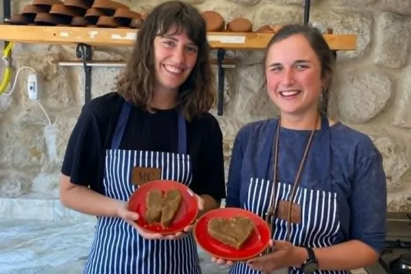Cooking-Class---2-smiling-girls-holding-plates