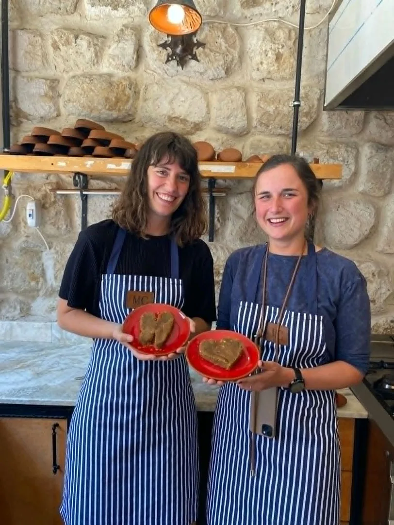 Cooking-Class---2-smiling-girls-holding-plates