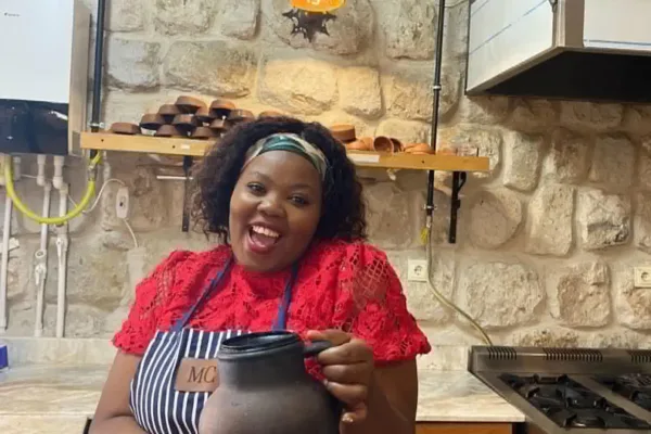Cooking-Class---Woman-smailing-holding-jug