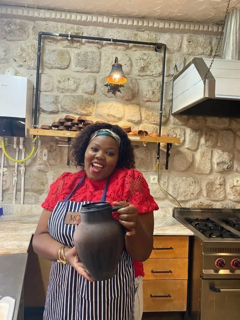 Cooking-Class---Woman-smailing-holding-jug